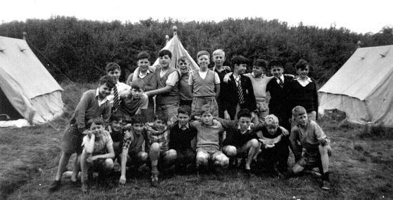 boys posing in tent field